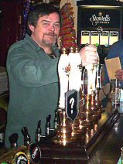 Mr P. J. Riordan with the Charlton's traditional beer pumps (2004) and ..